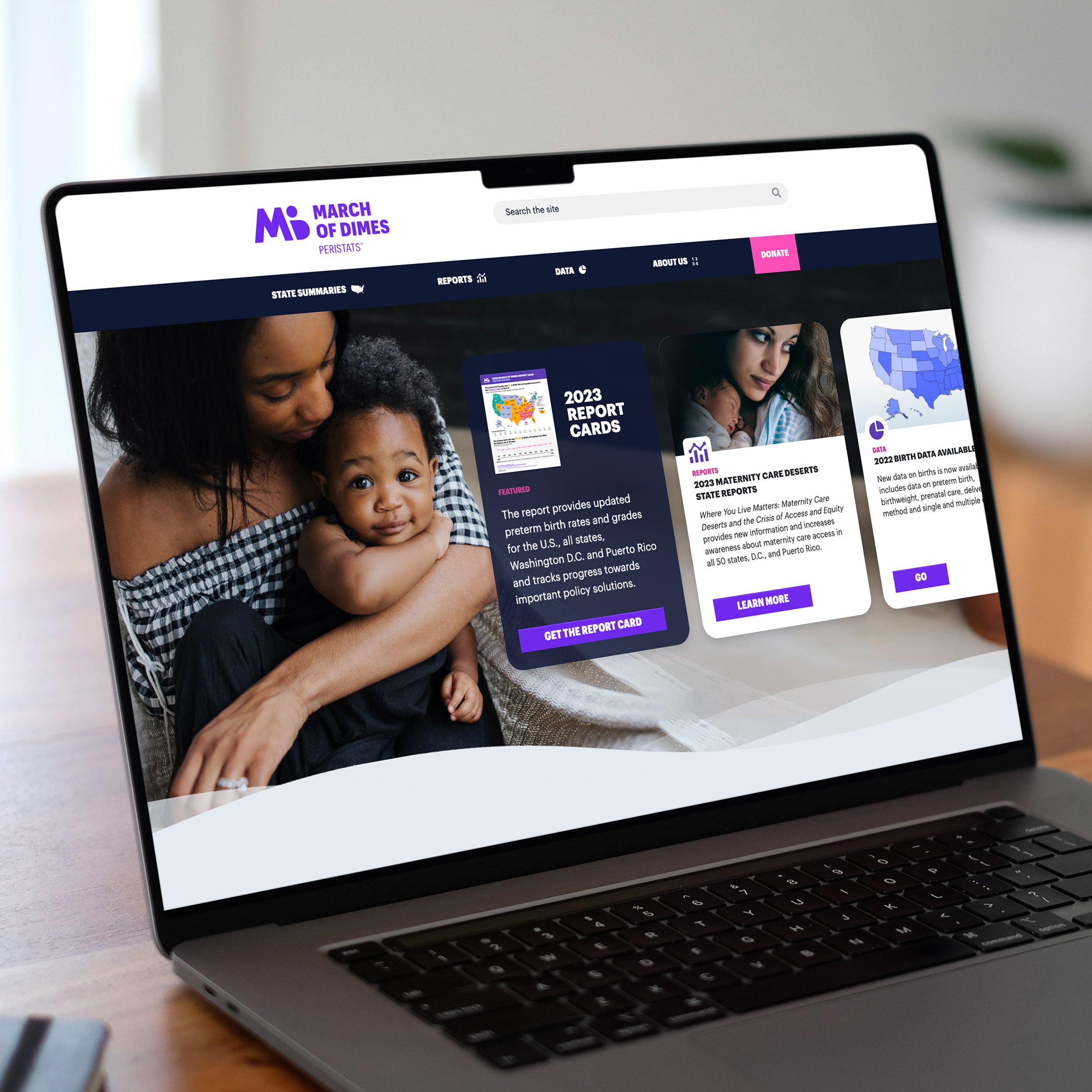 Laptop sitting on a table showing the March of Dimes Peristats website