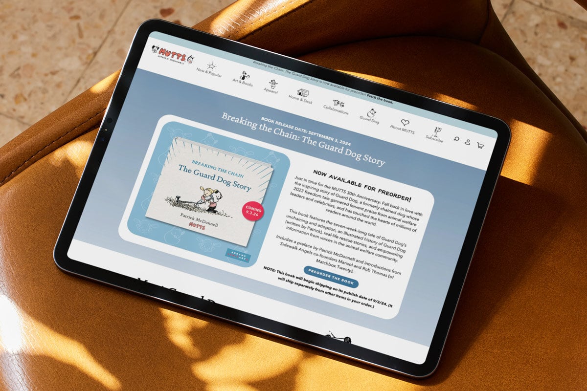 Tablet laying on a chair showing the MUTTS comics website